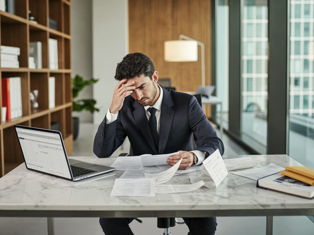 Business owner reviewing a confusing payroll spreadsheet