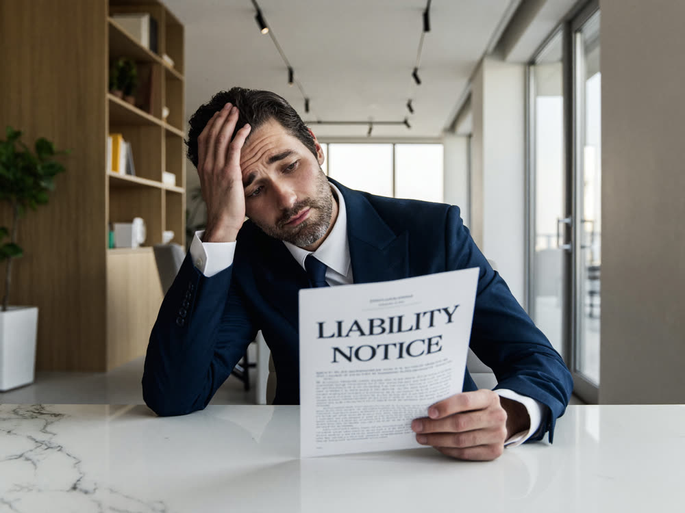 Business owner concerned about a liability notice document