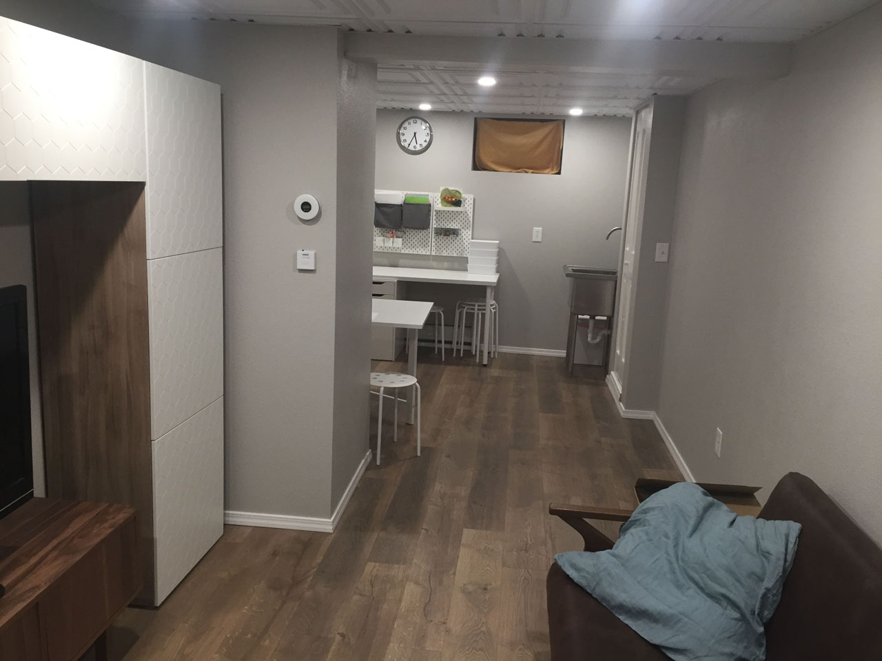 Finished basement recreation room with custom built-ins