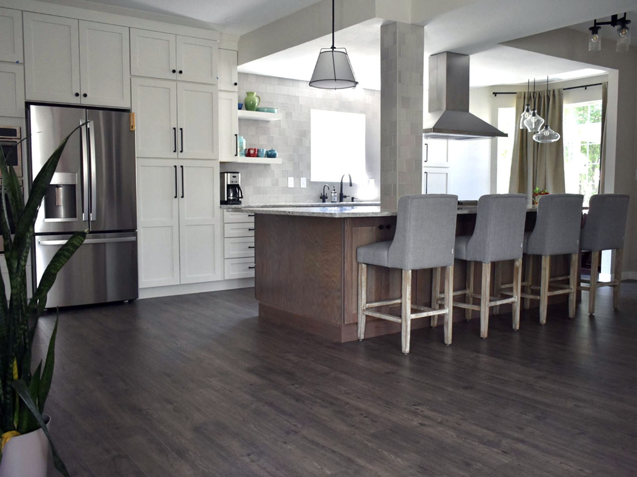 Kitchen with grey herringbone tile backsplash