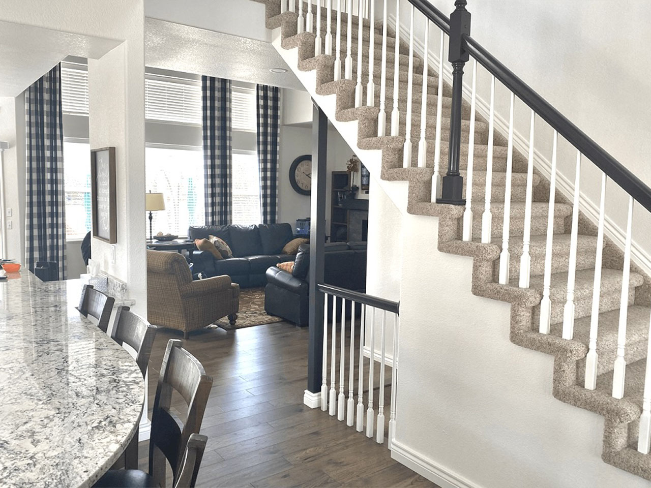 Living room and staircase viewed from kitchen island