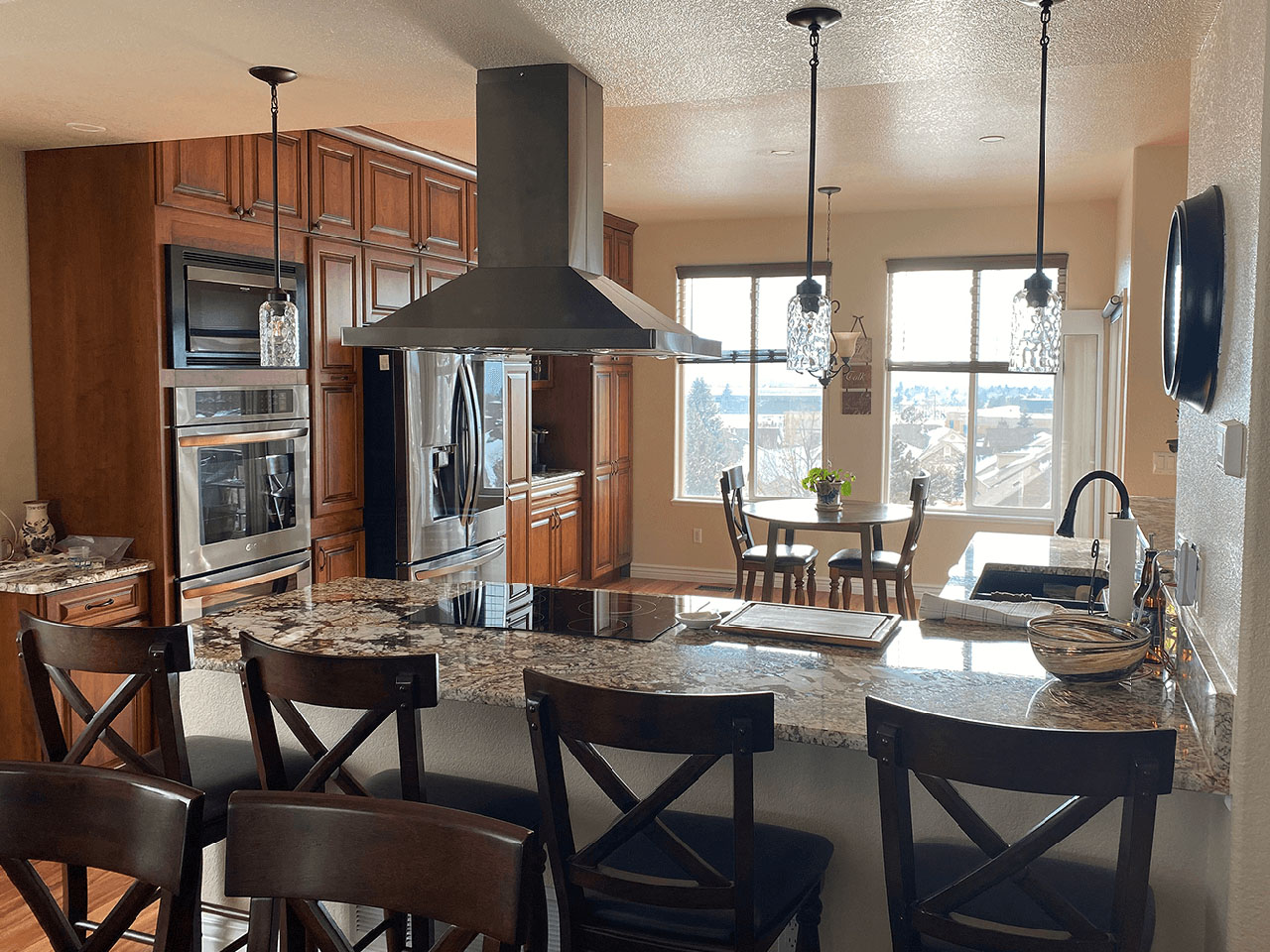 Modern kitchen with vaulted ceiling and skylights