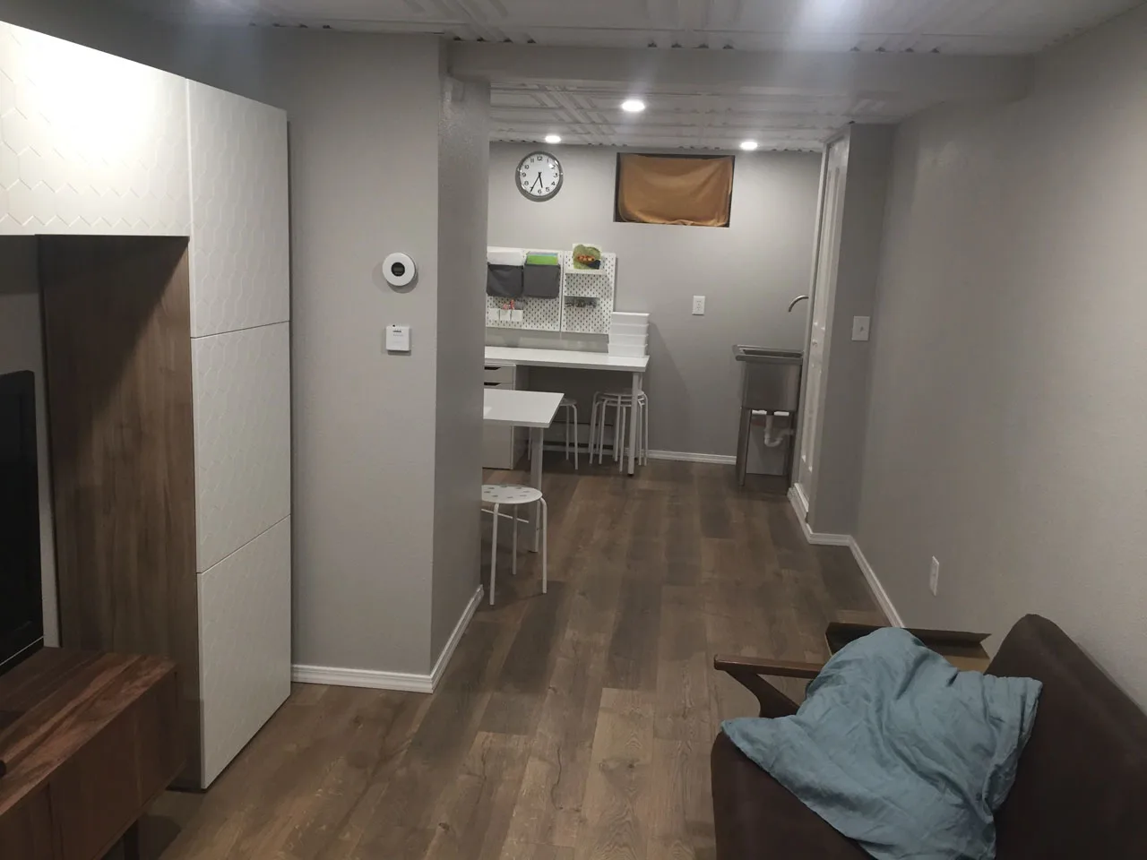 Finished basement recreation room with custom built-ins