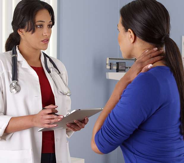 Primary care provider speaking with a patient during a visit at Millennium Medical Care in Reston, VA