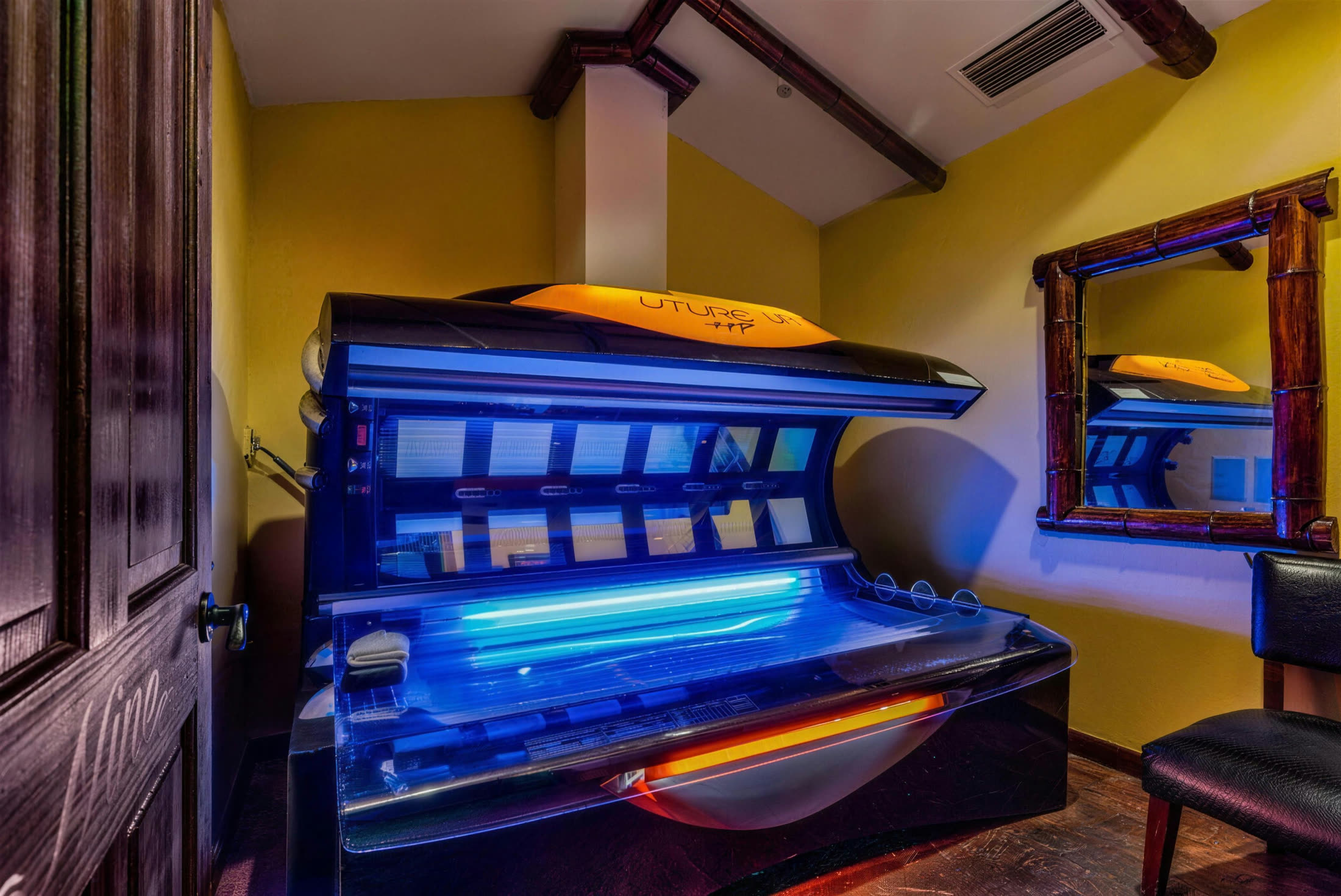 Premium tanning bed inside the Boca Tanning Club salon in Coral Springs
