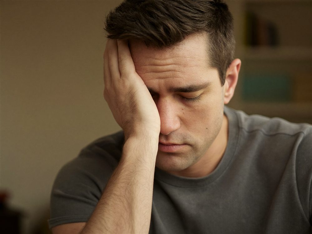 Discouraged homebuyer after a disappointing conversation with his bank