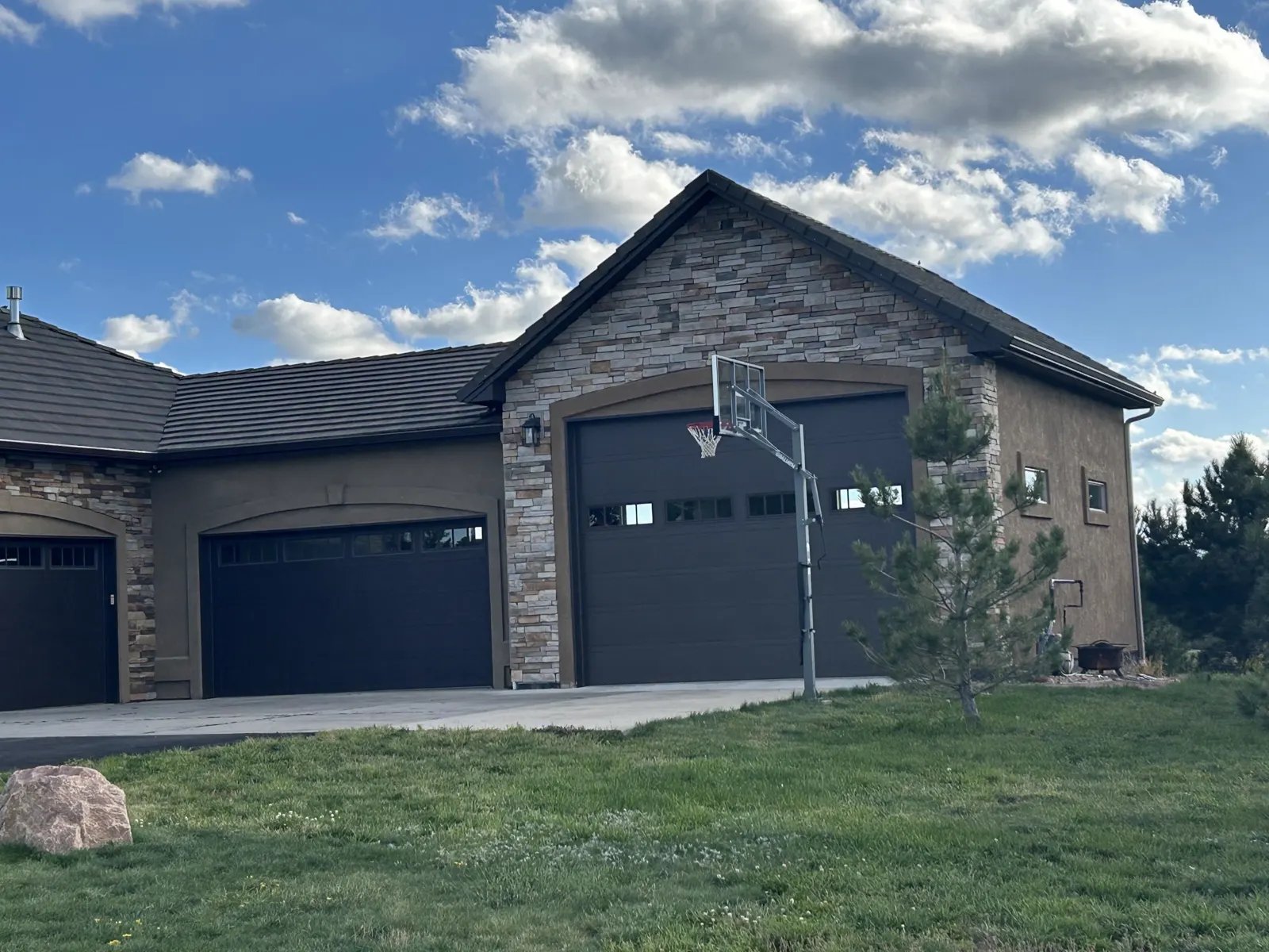 Stone and stucco garage addition