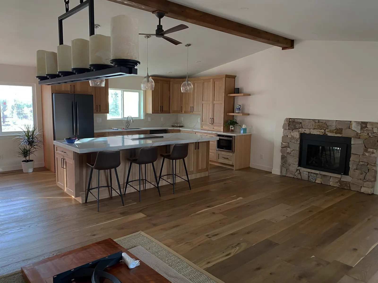 Signature kitchen and great room remodel with stone fireplace