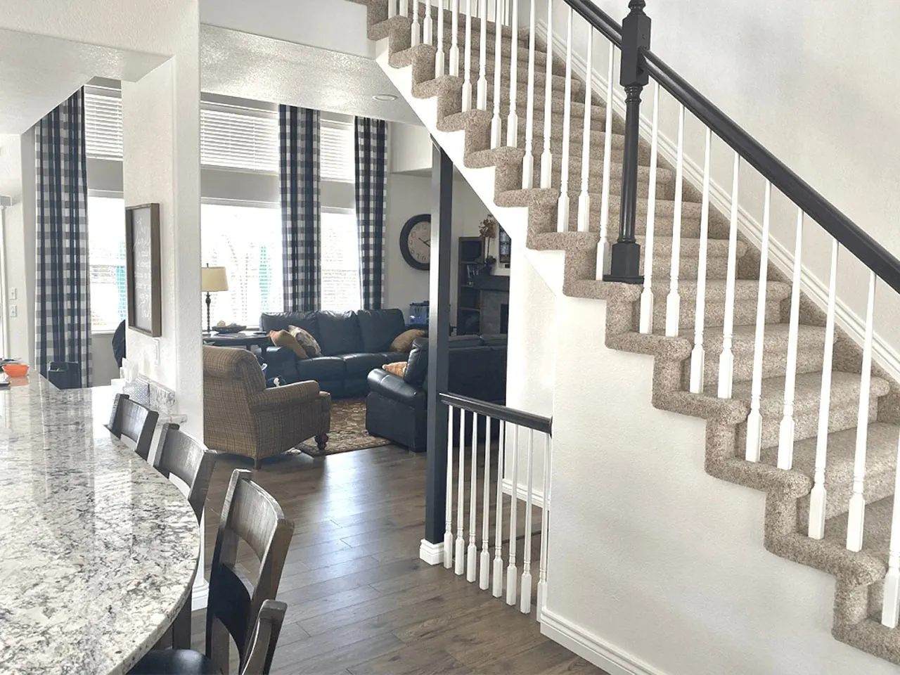 Living room and staircase viewed from kitchen island