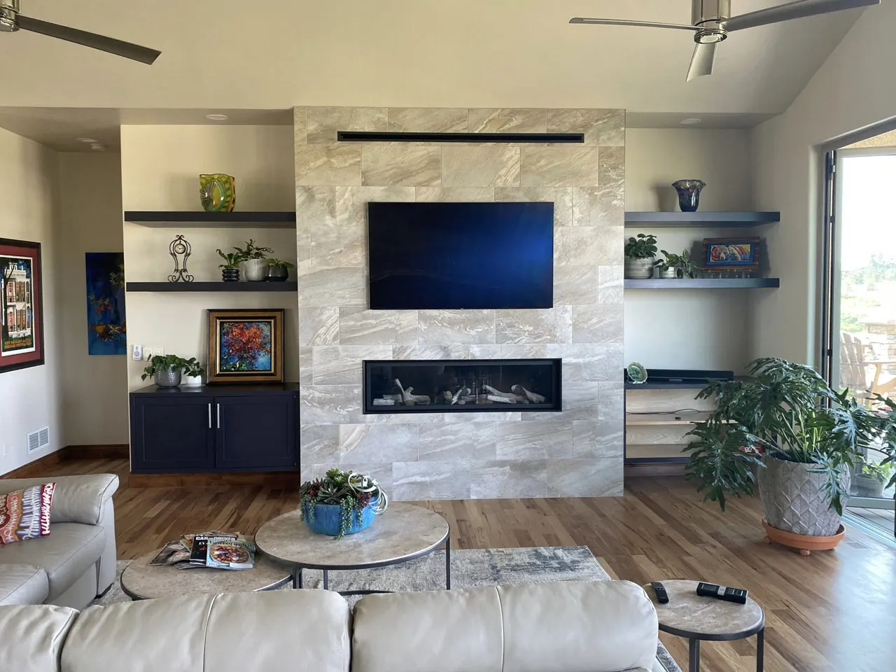 Living room with floor-to-ceiling stacked stone fireplace
