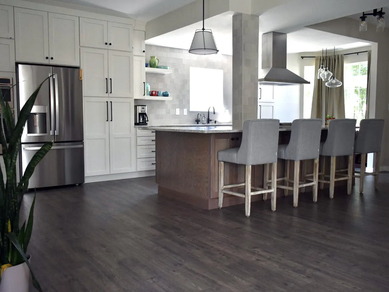 Kitchen with grey herringbone tile backsplash