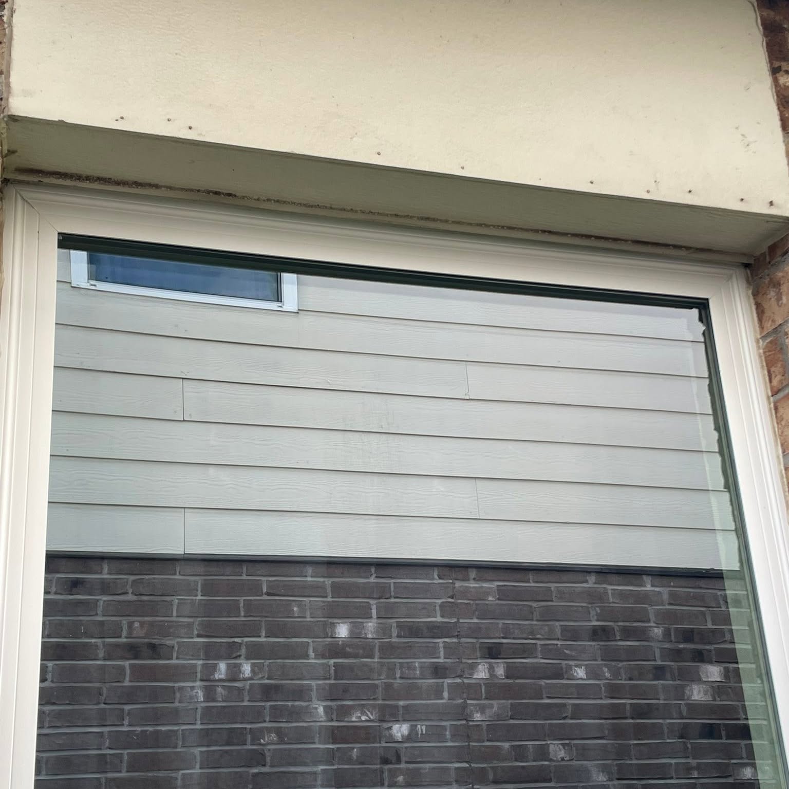 Window and siding trim detail on a Houston home exterior