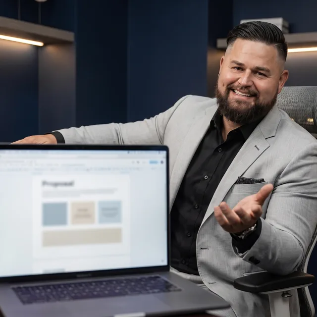 Ad Boost strategist reviewing a client growth proposal on a laptop, representing a full-funnel marketing review