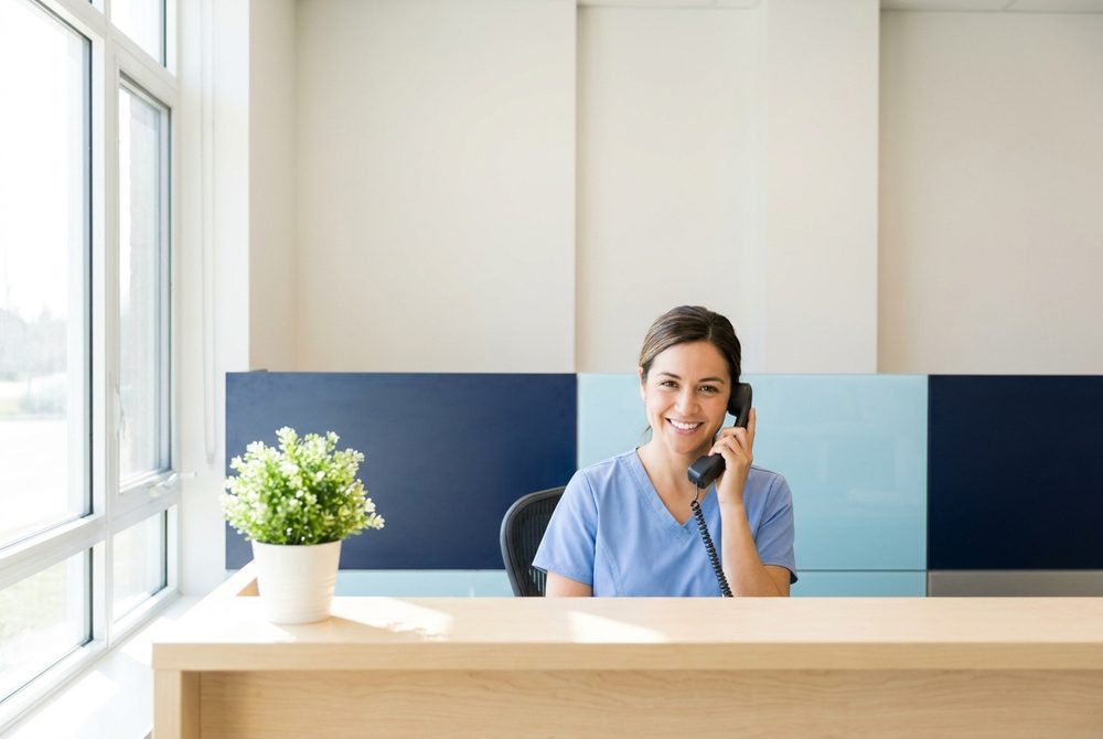 Front desk confirming an appointment by phone