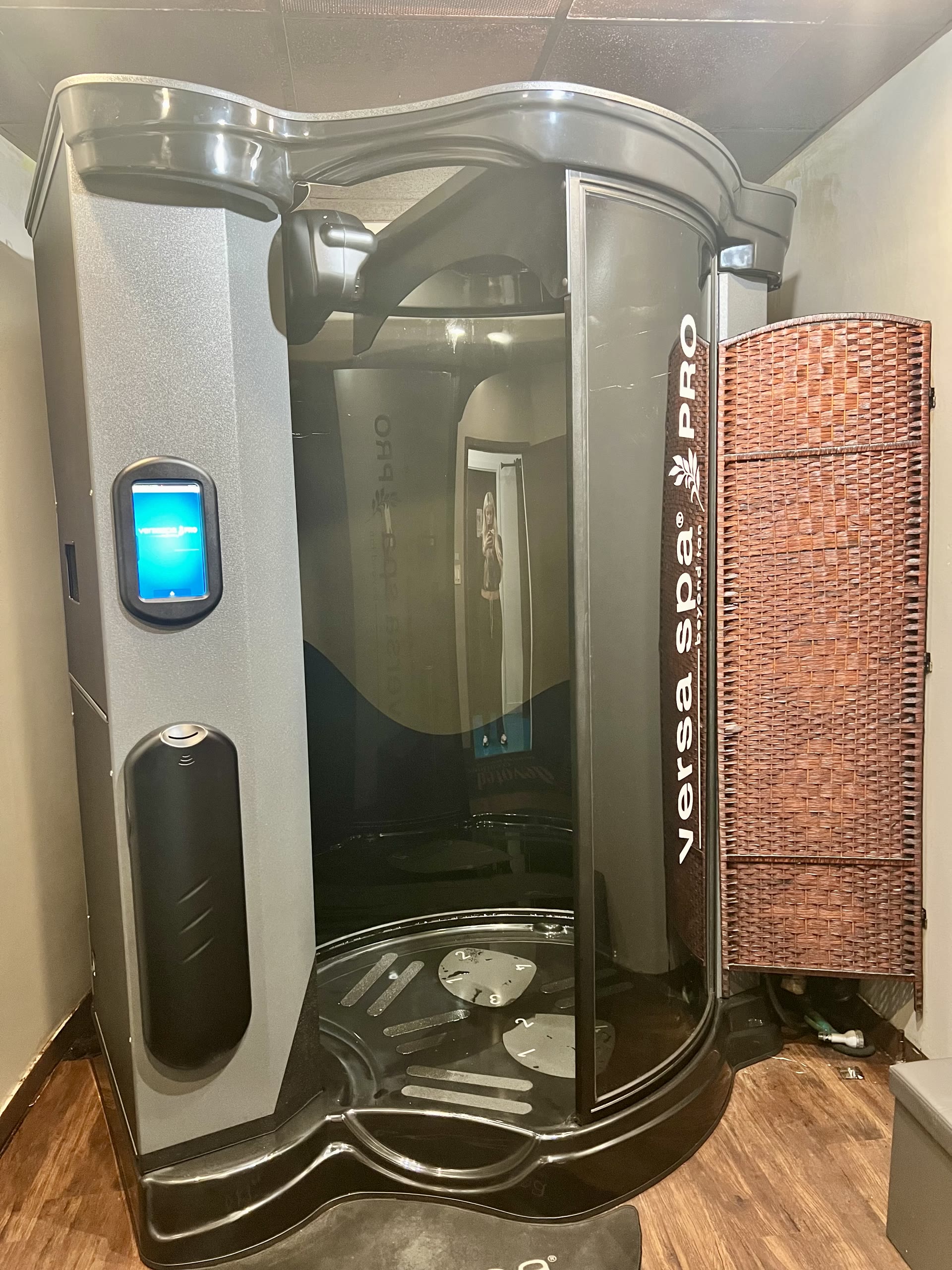 VersaSpa Pro sunless spray tanning booth inside the Boca Tanning Club East Boca salon