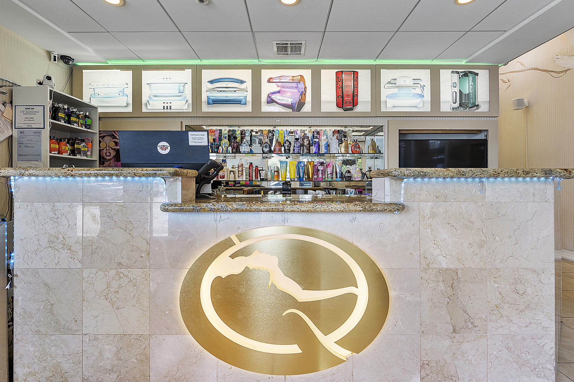 Front desk and equipment display inside Boca Tanning Club's Pompano Beach salon