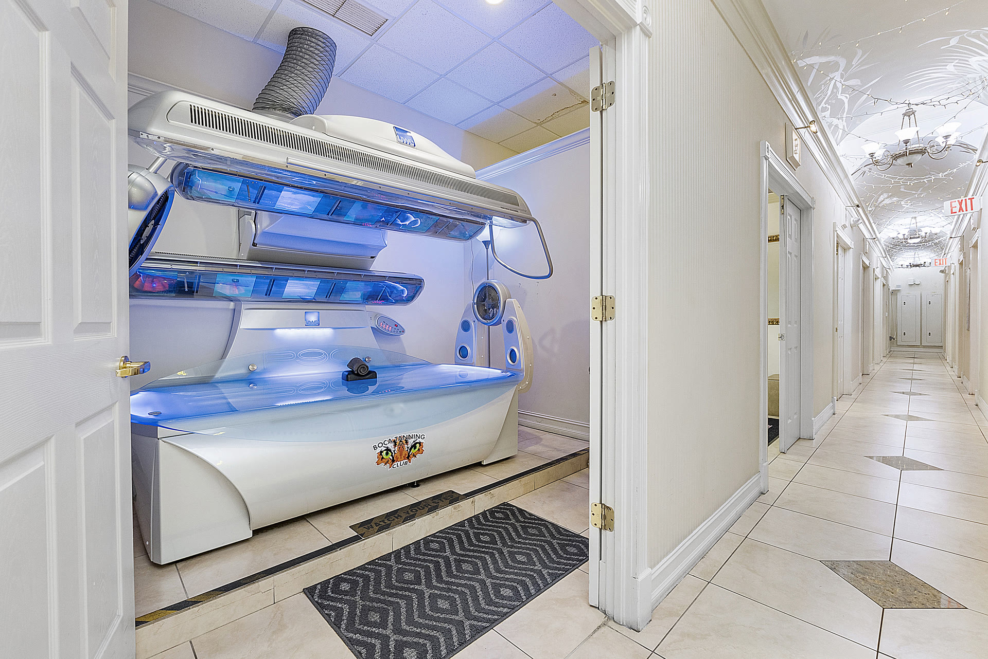 Stand-up UV tanning booth at Boca Tanning Club's Pompano Beach salon
