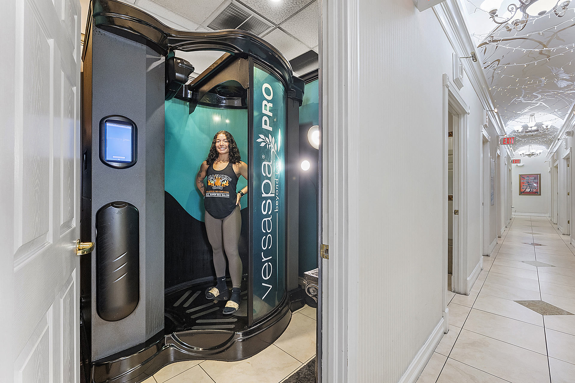 VersaSpa Pro sunless spray tanning booth inside the Boca Tanning Club Pompano Beach salon