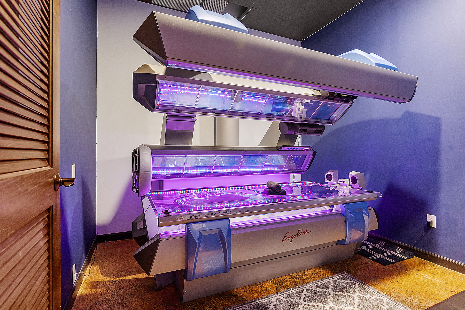 Ergoline high-pressure laydown tanning bed at Boca Tanning Club's Coral Springs salon