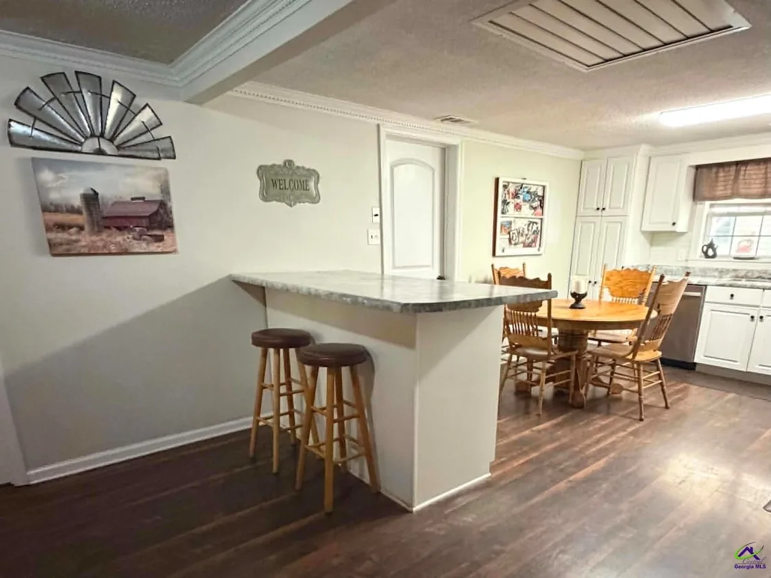 Kitchen with breakfast bar opening to the dining area