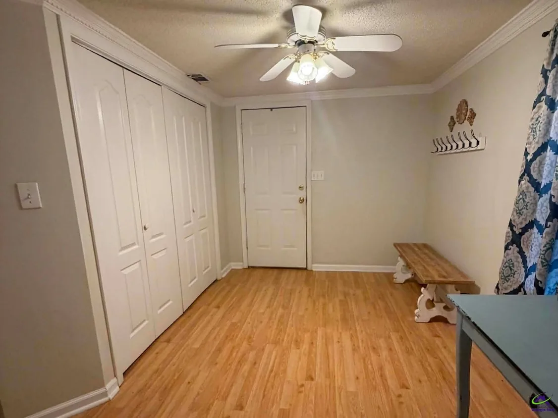 Bright flexible room with closets and a private exterior door