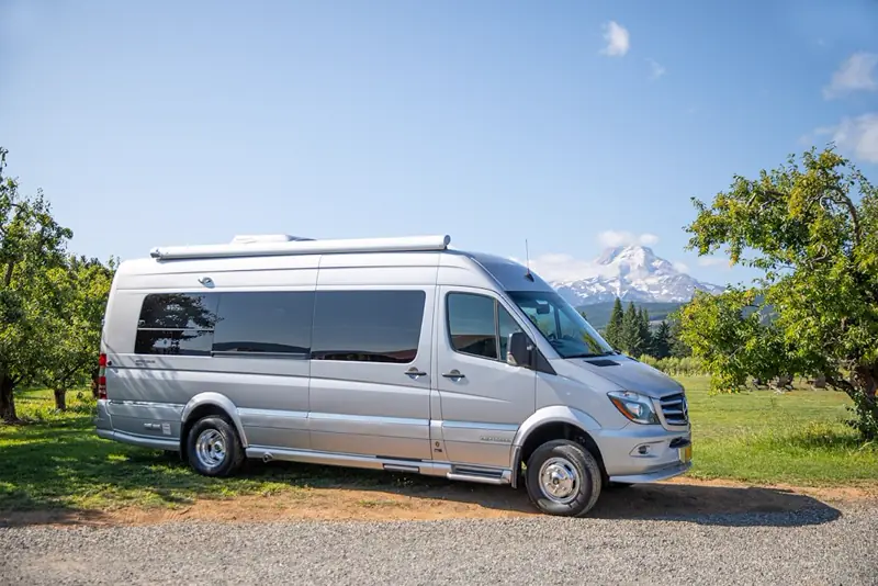 RV Best campervan parked in the mountains, ready to rent