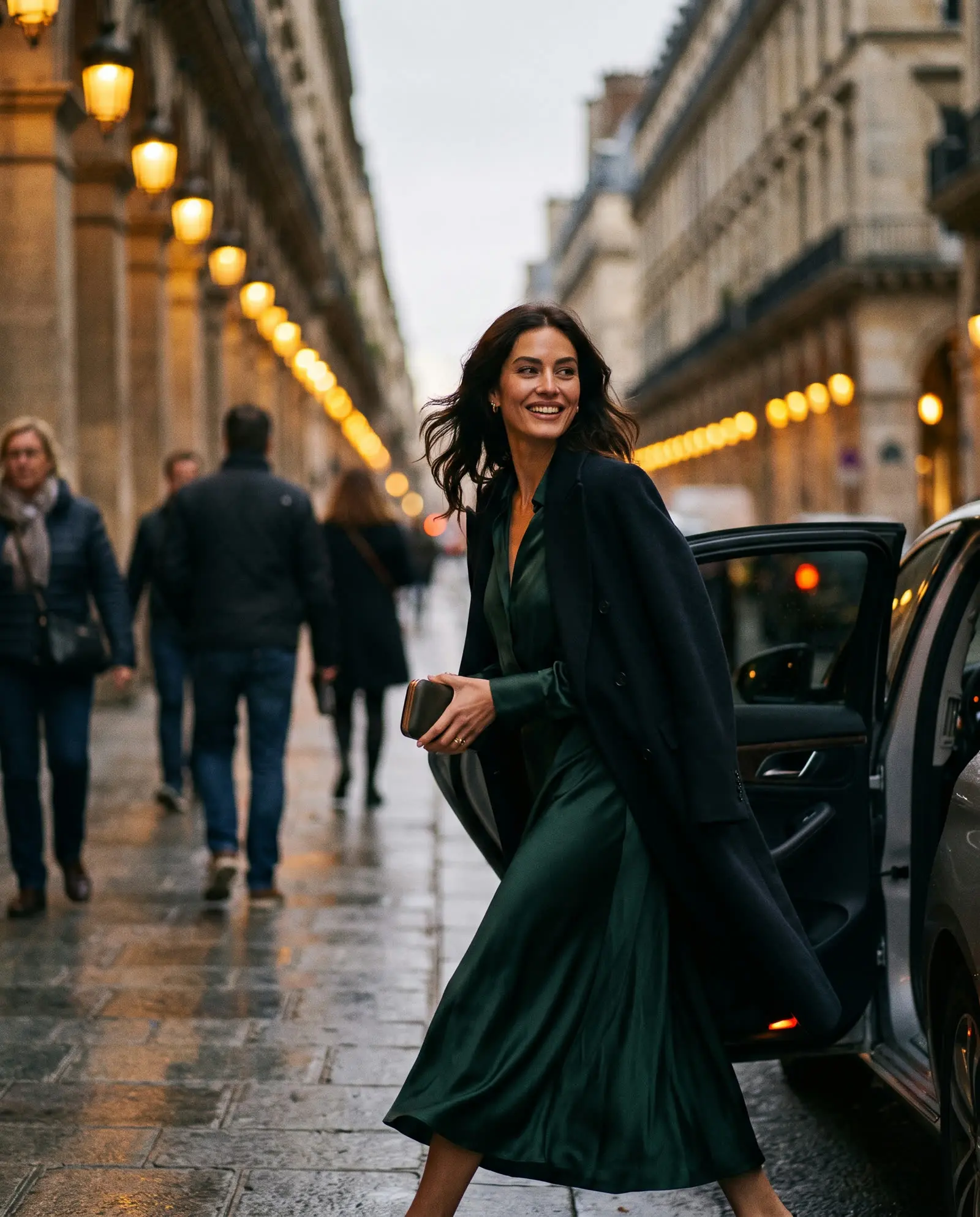 A woman in a green dress stepping out for dinner