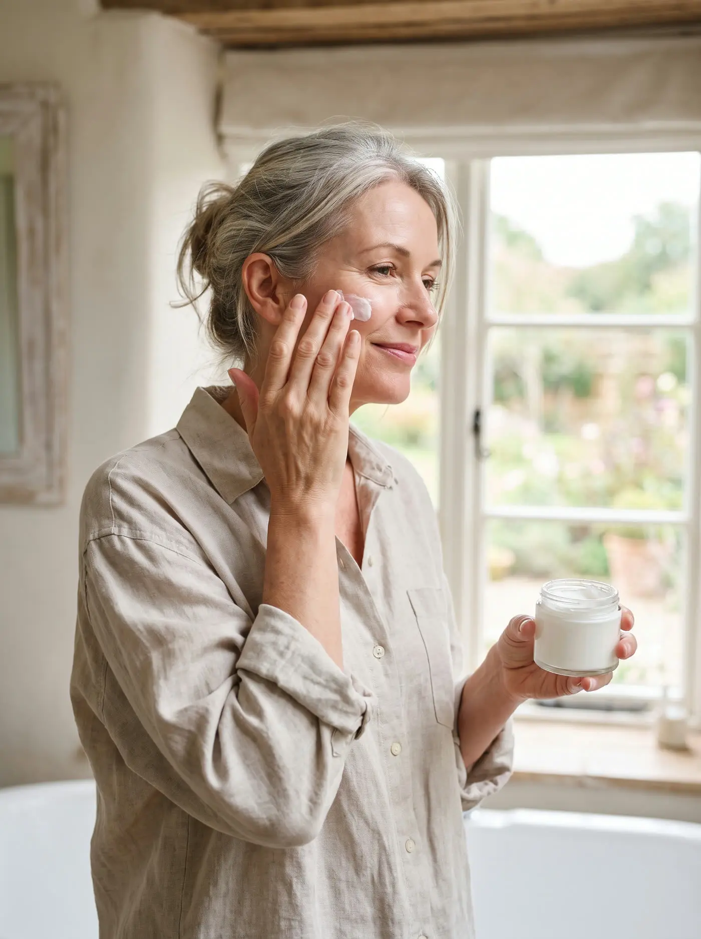 A woman enjoying a calm morning skincare moment