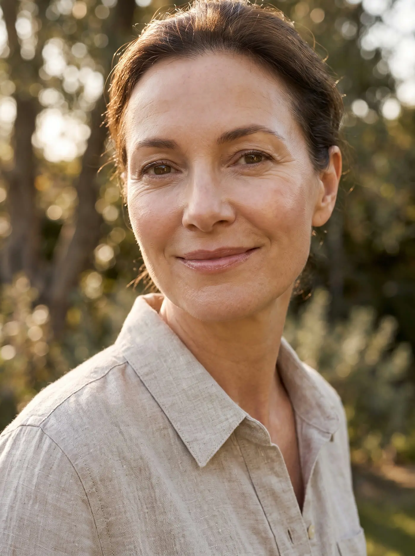 A woman with a fresh, radiant complexion in sunlight