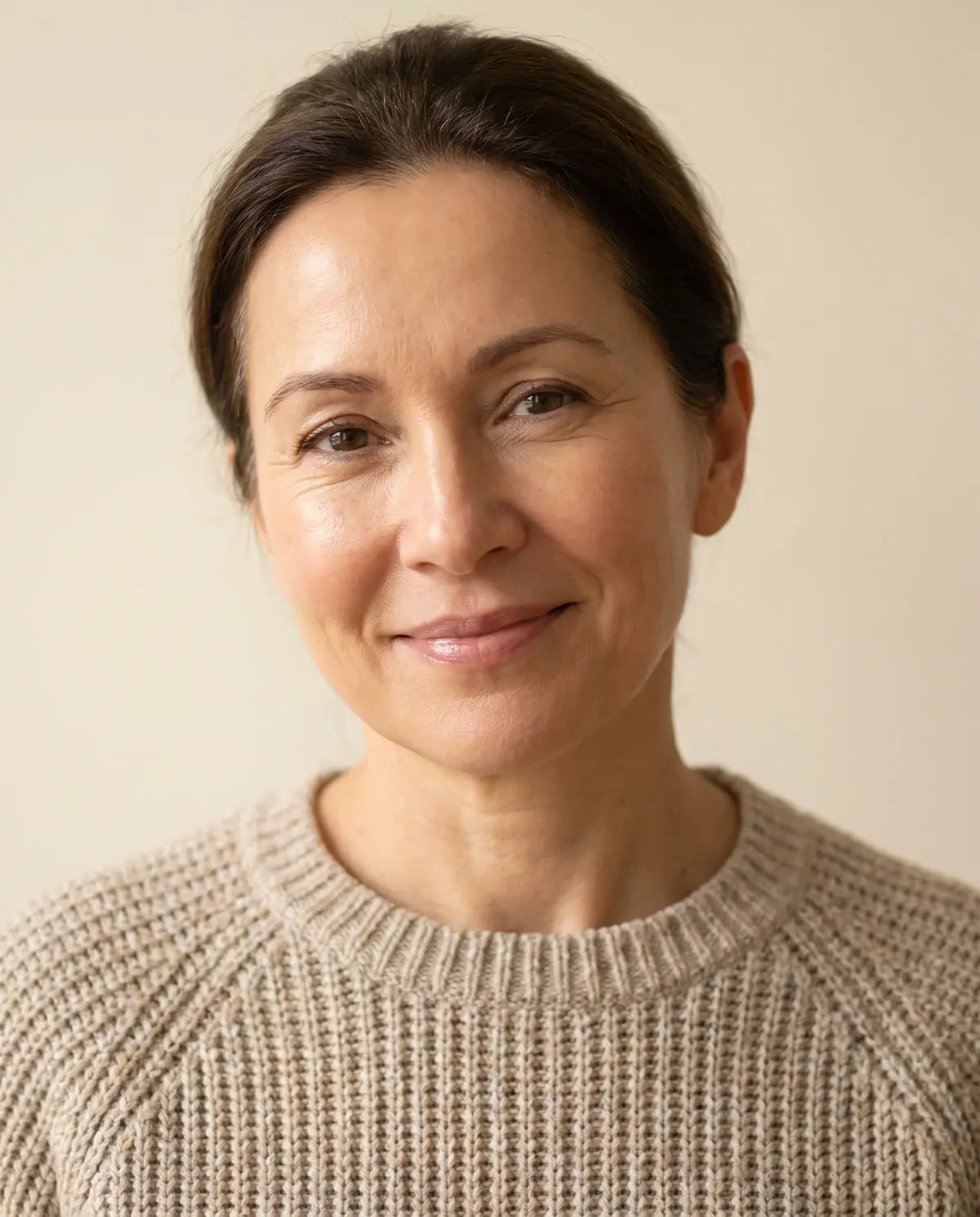 A woman with luminous skin and a gentle smile